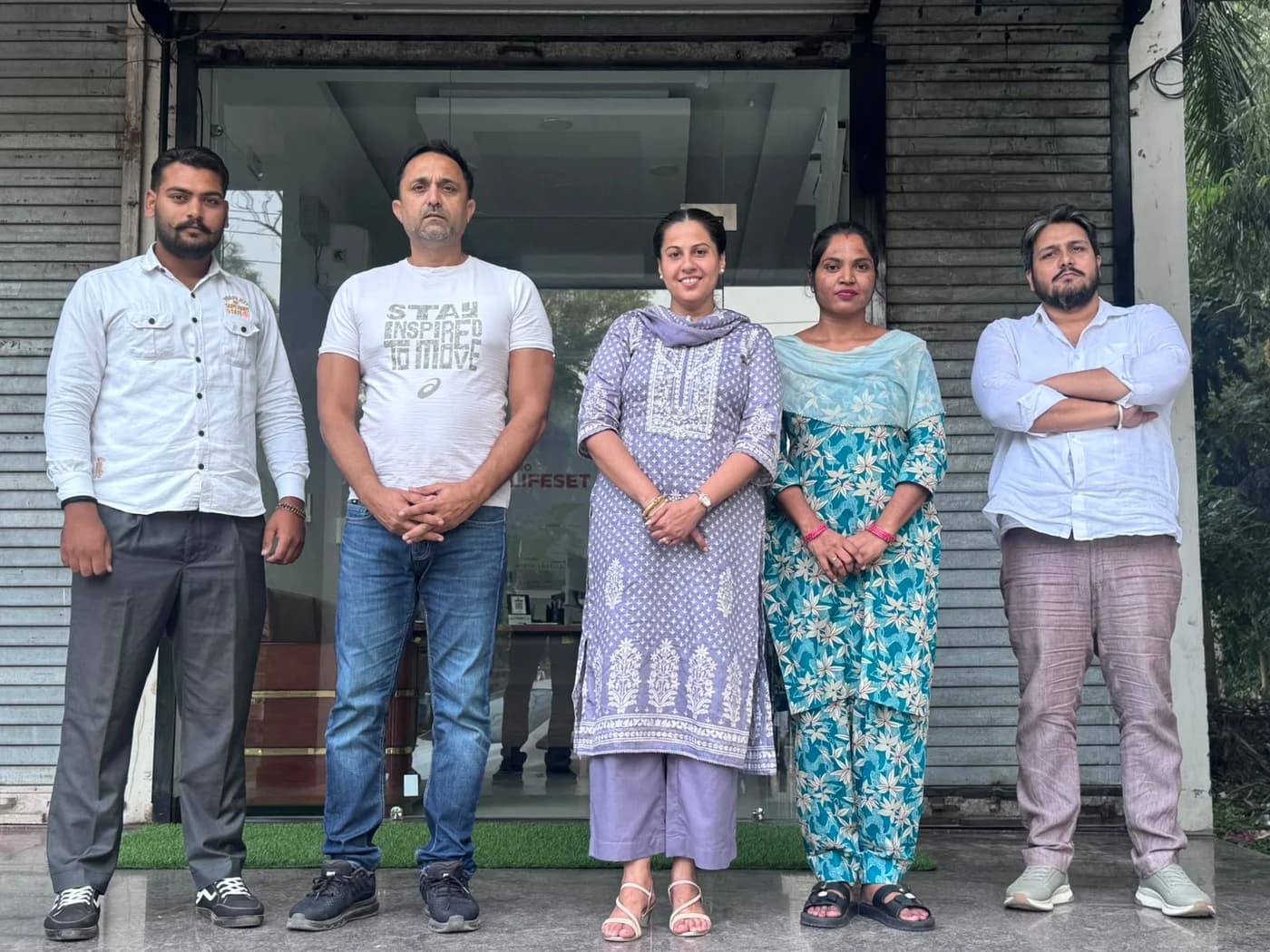 Five members of the Lifeset Overseas team outside their office